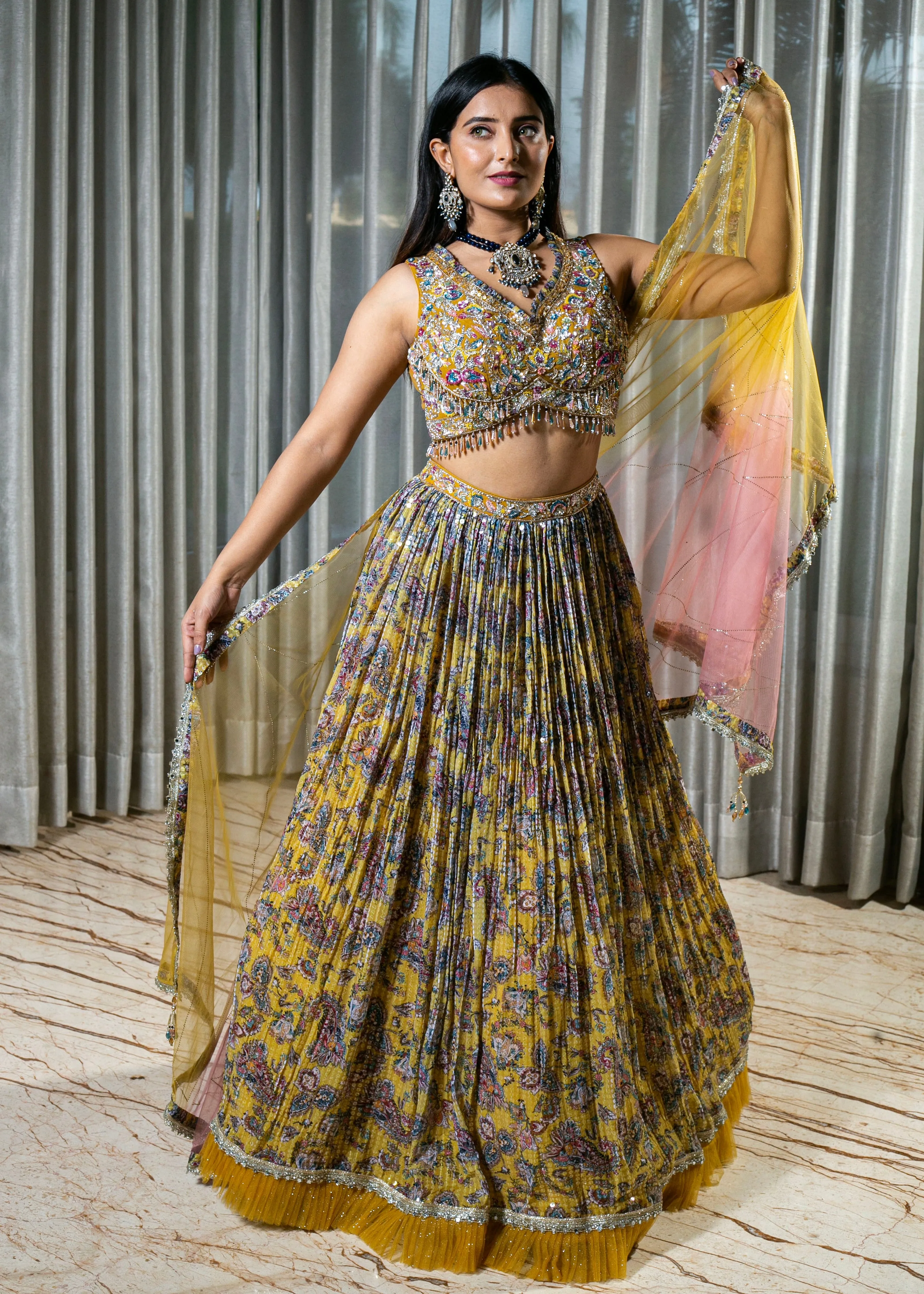 Flared Yellow Lehenga with Intricate Embroidery and Net Dupatta